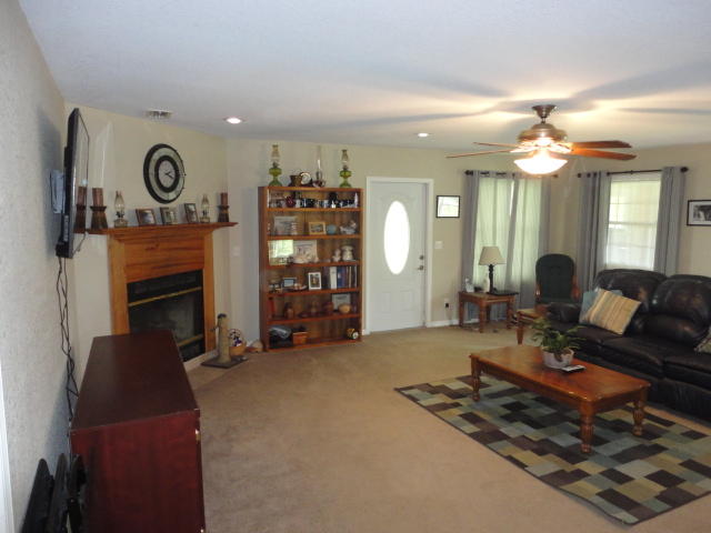 6404 Old River Road Baker, FL 32531 - Photo 16 of 28 a living room with furniture and a fireplace