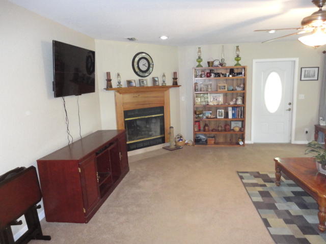 6404 Old River Road Baker, FL 32531 - Photo 17 of 28 a living room with furniture and a flat screen tv