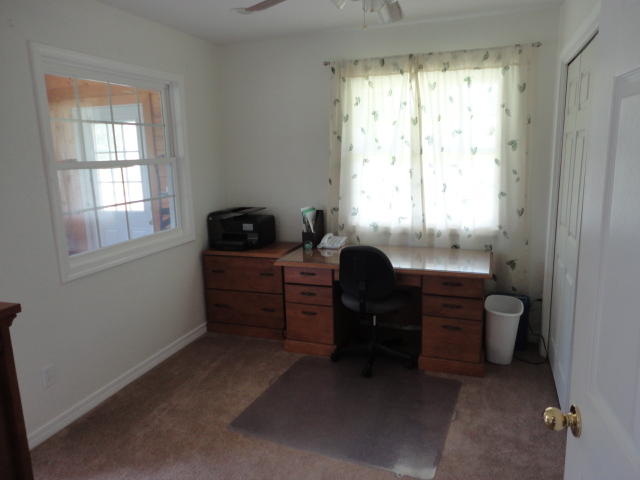 6404 Old River Road Baker, FL 32531 - Photo 18 of 28 a room with furniture and a window