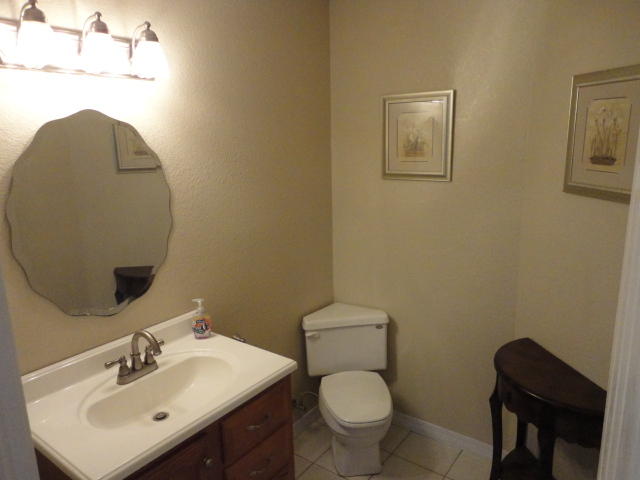 6404 Old River Road Baker, FL 32531 - Photo 20 of 28 a bathroom with a toilet a sink and mirror