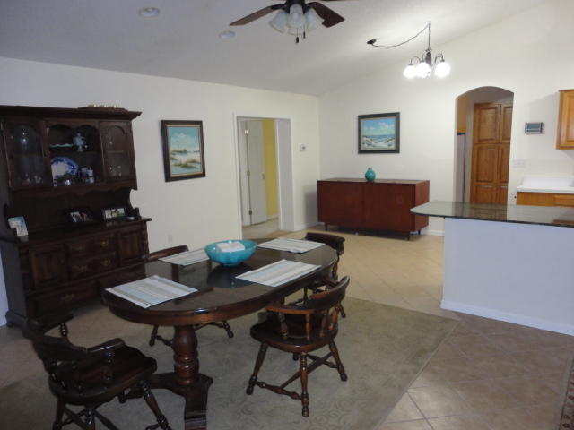 6404 Old River Road Baker, FL 32531 - Photo 22 of 28 a view of a dining room with furniture