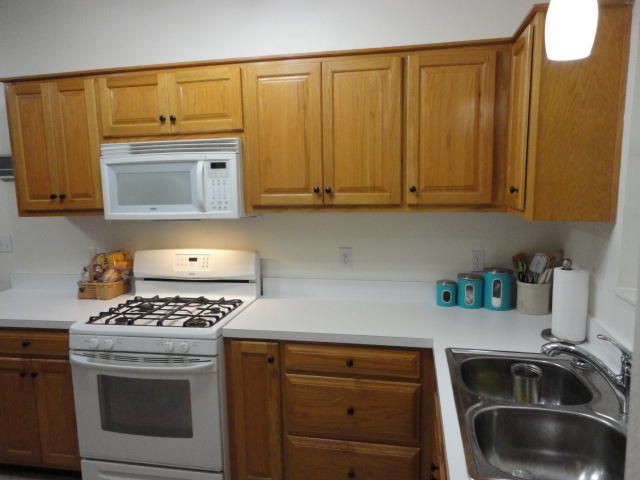 6404 Old River Road Baker, FL 32531 - Photo 23 of 28 a kitchen with granite countertop a sink cabinets and stainless steel appliances