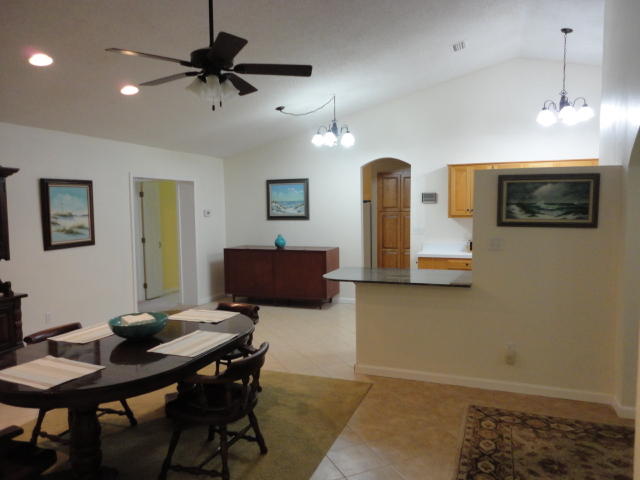 6404 Old River Road Baker, FL 32531 - Photo 27 of 28 a view of a livingroom with furniture and a flat screen tv
