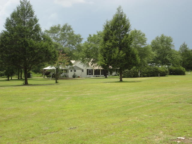 6404 Old River Road Baker, FL 32531 - Photo 3 of 28 a front view of a building with trees
