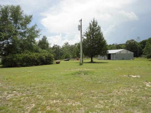 6404 Old River Road Baker, FL 32531 - Photo 4 of 28 a view of a field with an trees