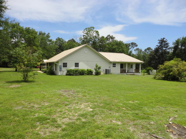6404 Old River Road Baker, FL 32531 - Photo 5 of 28 a view of a house with a yard