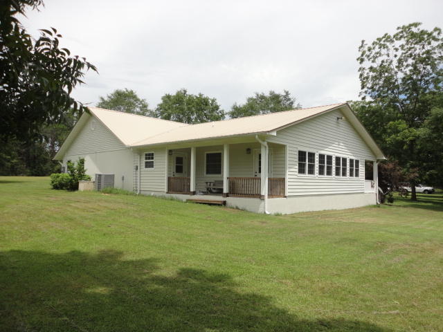 6404 Old River Road Baker, FL 32531 - Photo 6 of 28 a front view of a house with a garden
