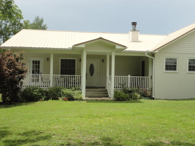 6404 Old River Road Baker, FL 32531 - Photo 8 of 28 a front view of a house with garden