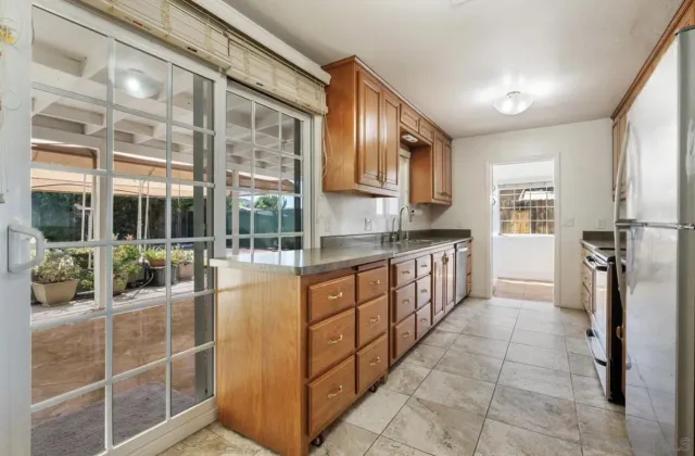 a kitchen with stainless steel appliances a sink and cabinets