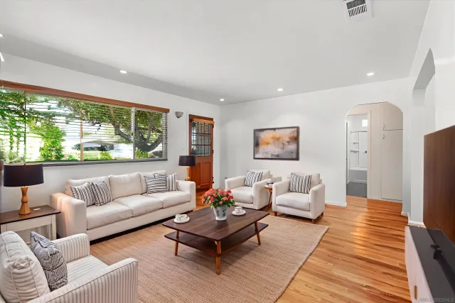 a living room with furniture and a rug
