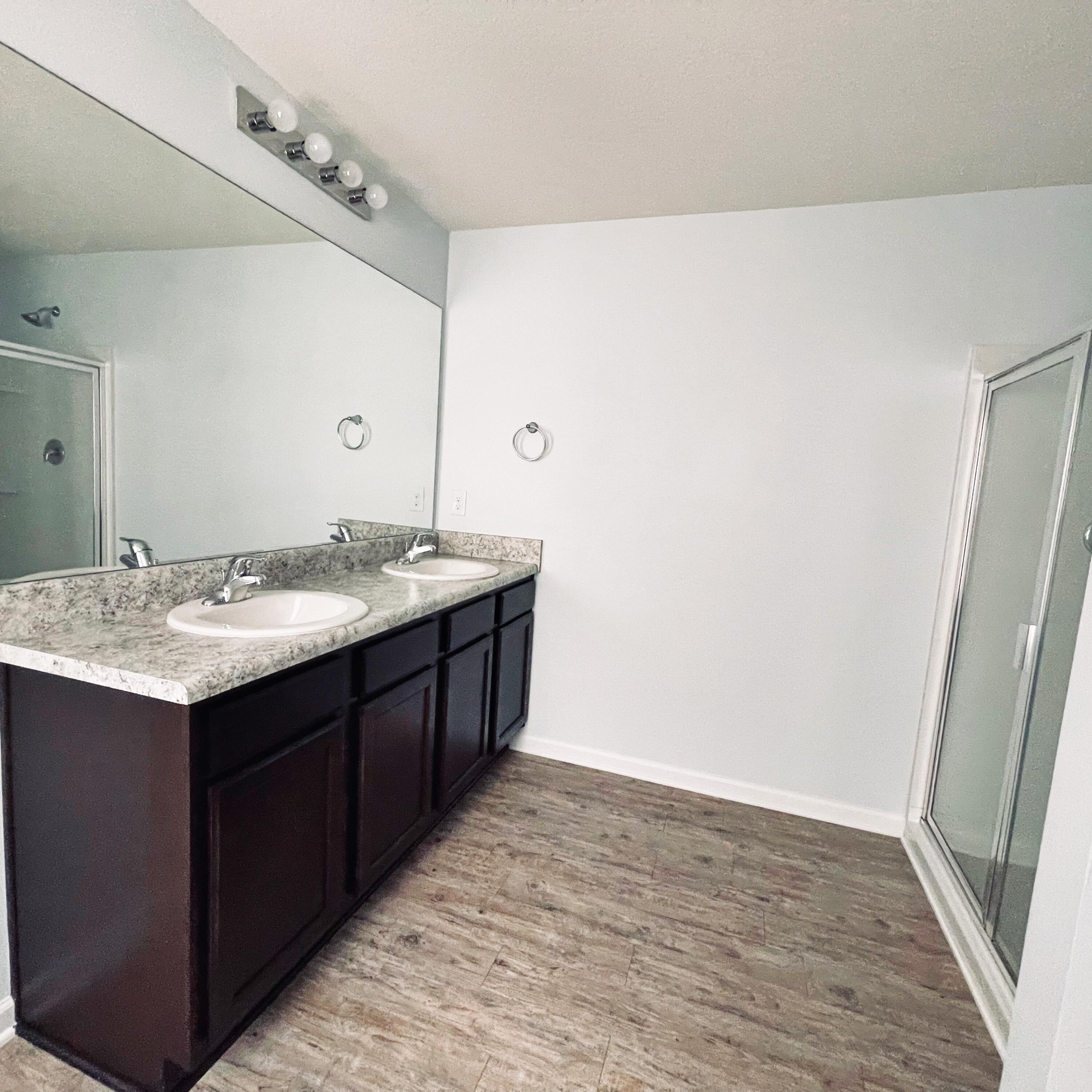745 Widgeon Way Crestview, FL 32539 - Photo 16 of 17 a bathroom with a granite countertop sink and a mirror