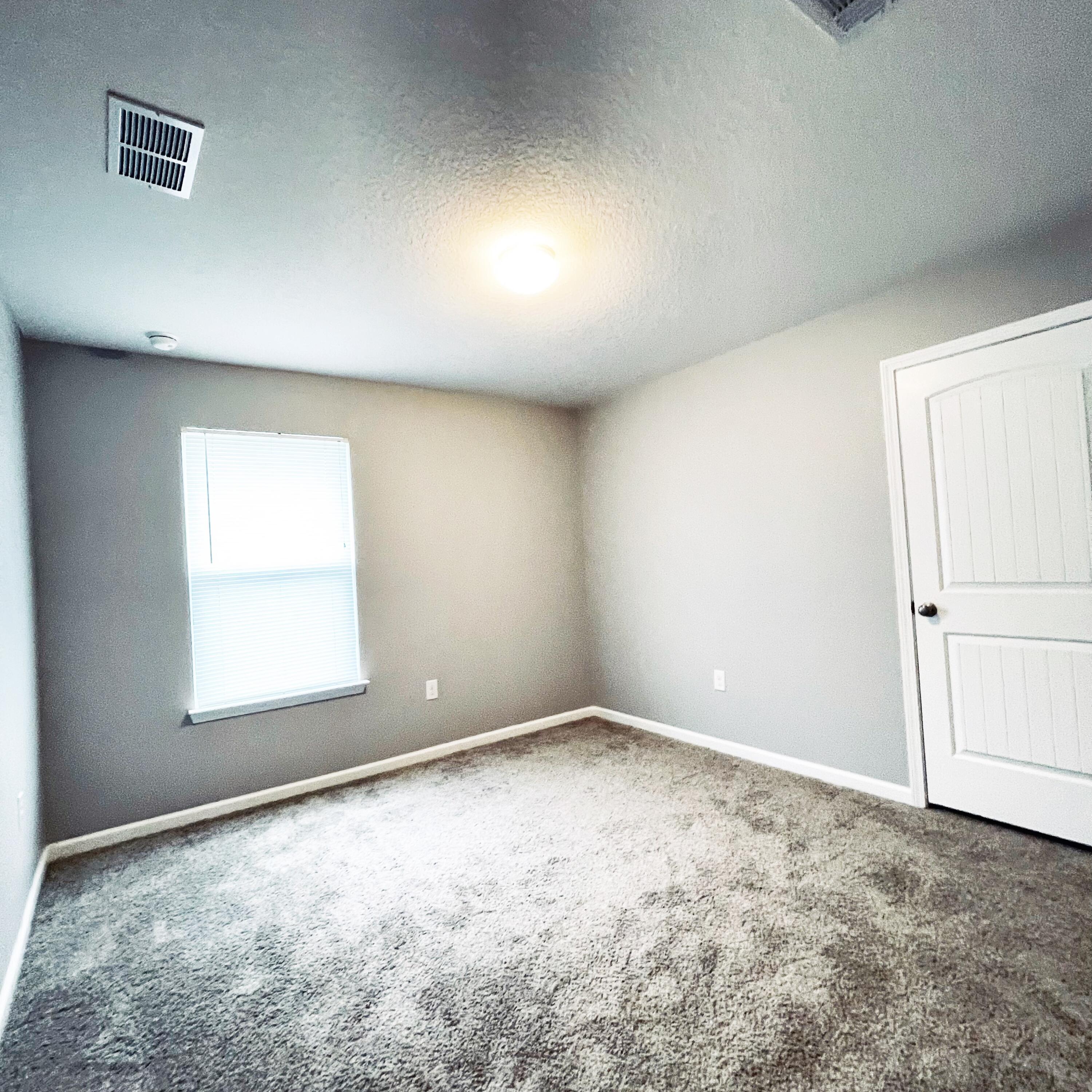 745 Widgeon Way Crestview, FL 32539 - Photo 2 of 17 an empty room with a window