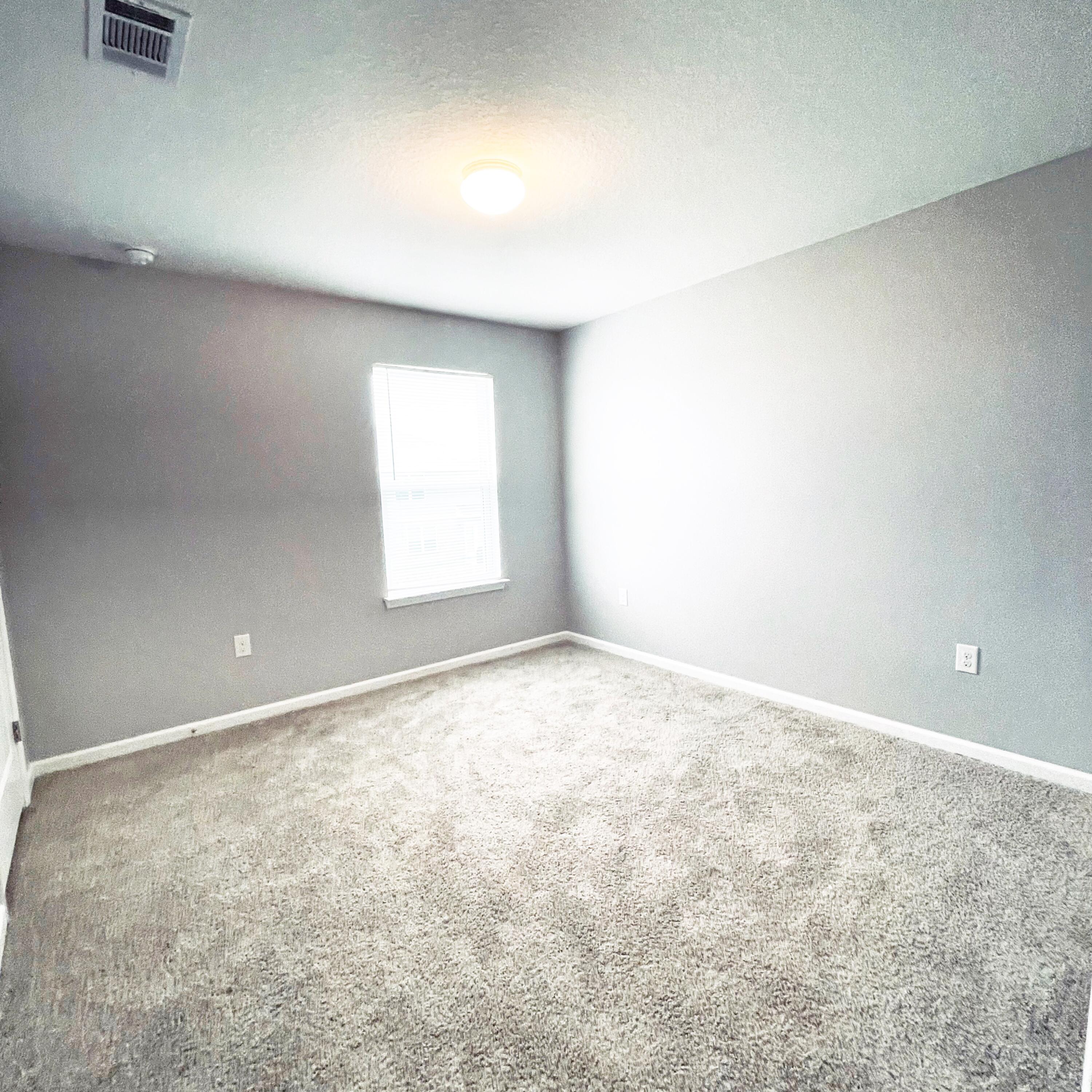 745 Widgeon Way Crestview, FL 32539 - Photo 9 of 17 an empty room with a window