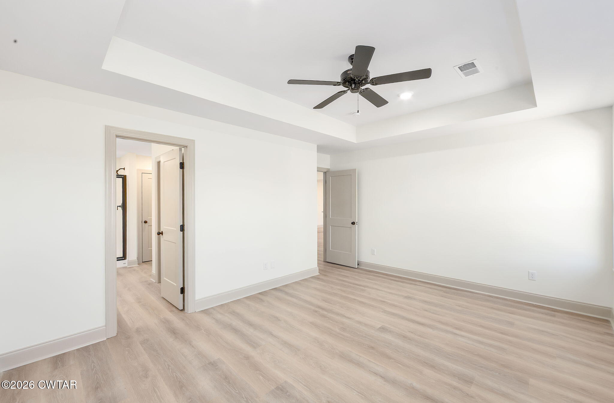 77 Grande Pnes Cove Jackson, TN 38305 - Photo 13 of 31 a view of a room with wooden floor and ceiling fan