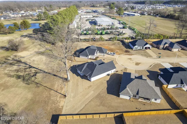 an aerial view of a house with lake view