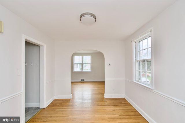 a kitchen with a sink stainless steel appliances and cabinets