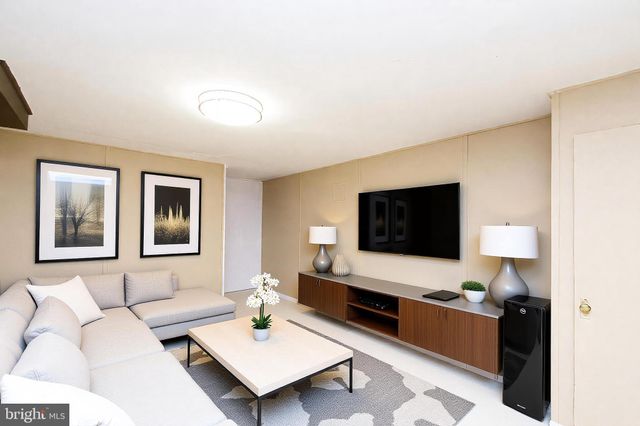 a utility room with a sink dryer and washer