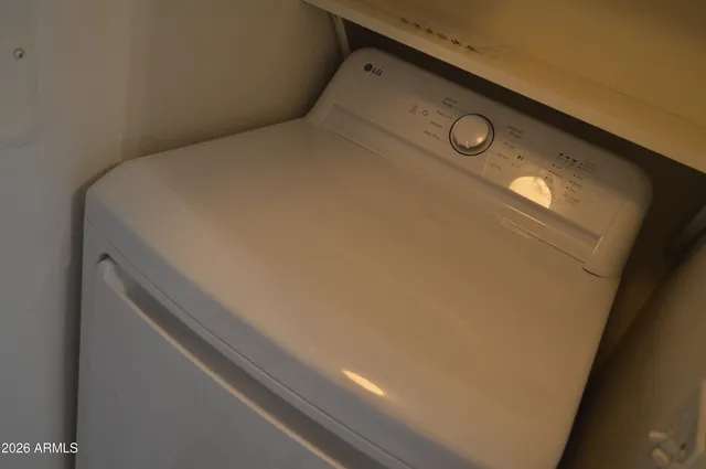 a bathroom with a bathtub and a window