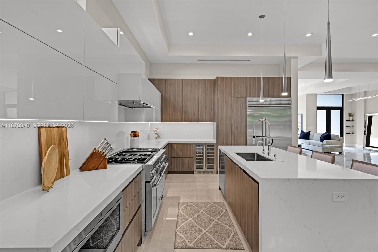 225 Northeast 3rd Street Boca Raton, FL 33432 - Photo 13 of 36 a kitchen that has a sink a stove and chairs