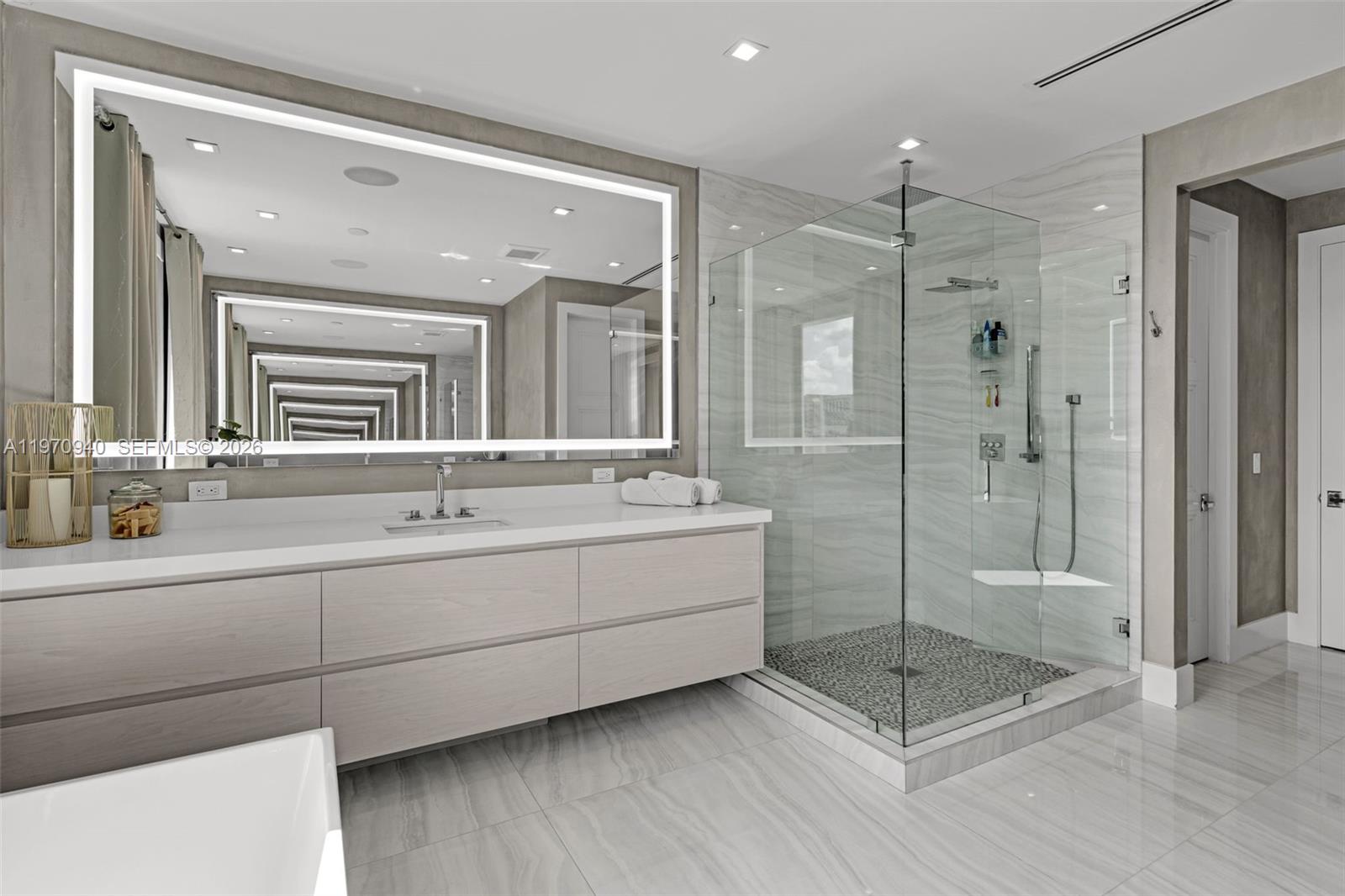 225 Northeast 3rd Street Boca Raton, FL 33432 - Photo 24 of 36 a bathroom with a double vanity sink mirror and shower