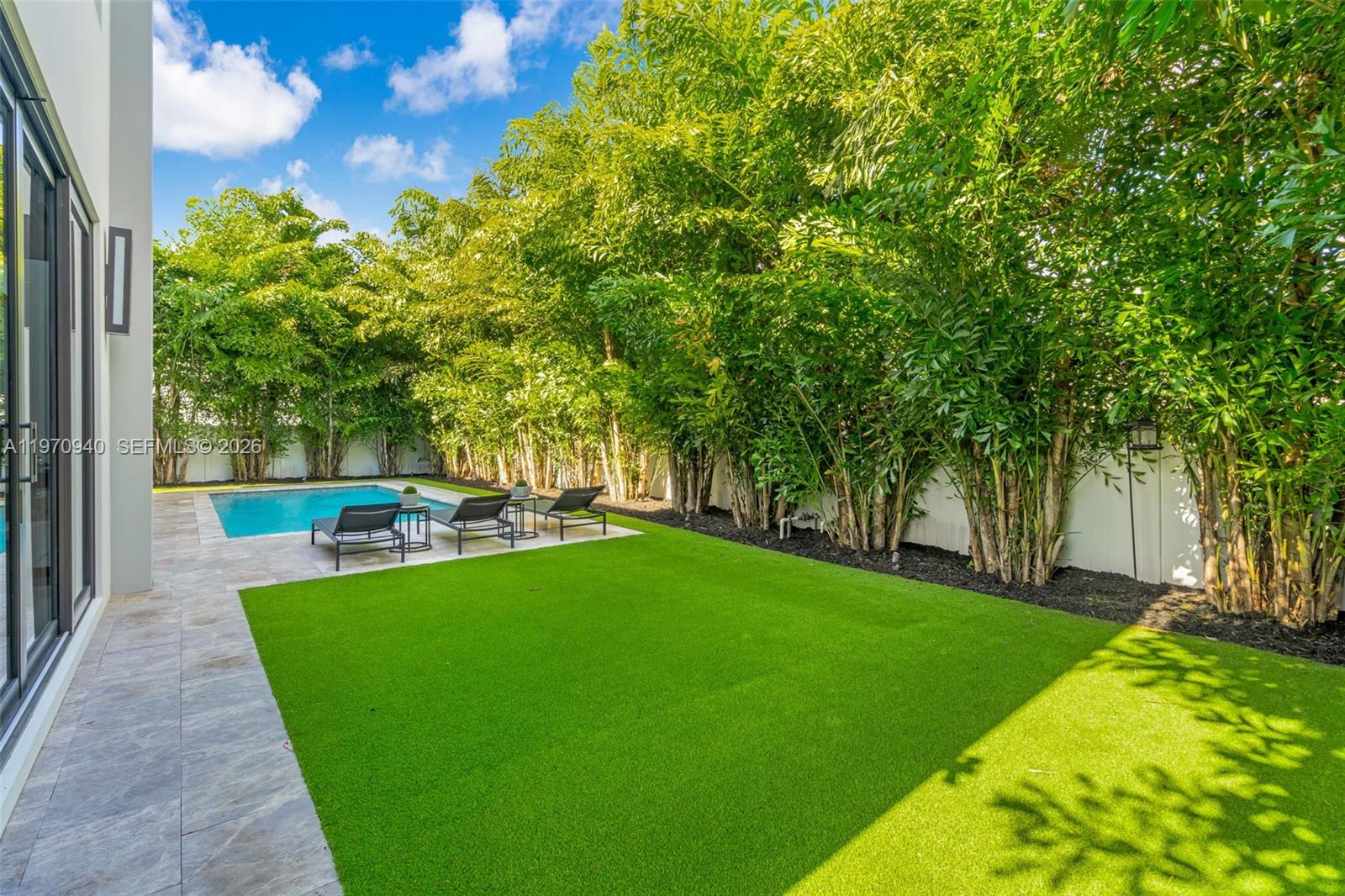 225 Northeast 3rd Street Boca Raton, FL 33432 - Photo 36 of 36 a view of a swimming pool with a patio