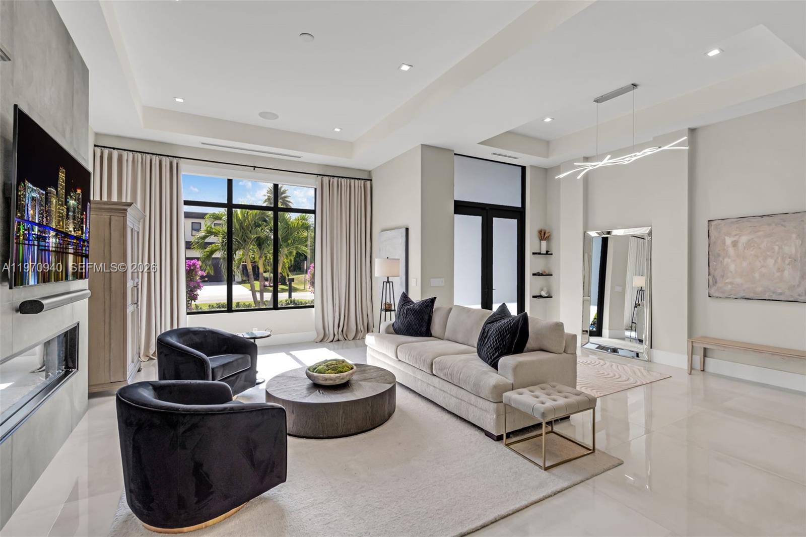 225 Northeast 3rd Street Boca Raton, FL 33432 - Photo 7 of 36 a living room with furniture and large windows