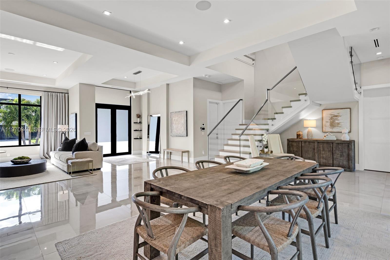 225 Northeast 3rd Street Boca Raton, FL 33432 - Photo 10 of 36 a view of a dining room and livingroom with furniture