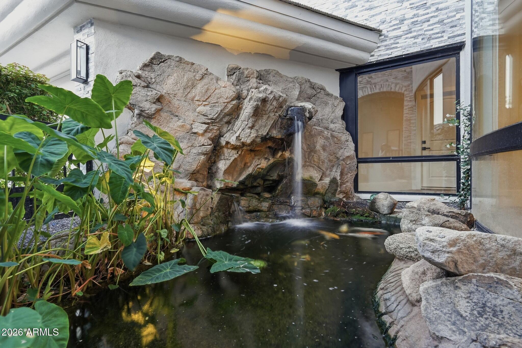 7475 East Gainey Ranch Road, Unit 7 Scottsdale, AZ 85258 - Photo 14 of 77 014_Relaxing Koi Pond