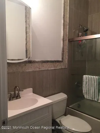 a bedroom with a bed and a table