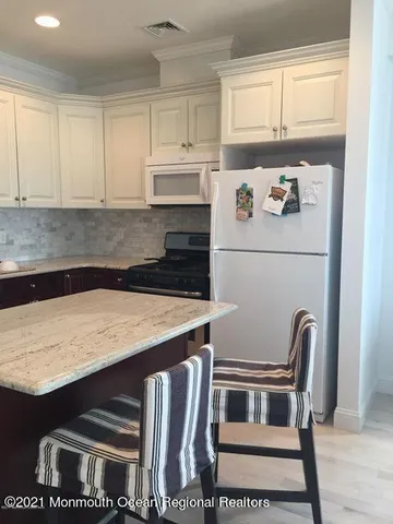 a utility room with washer and dryer