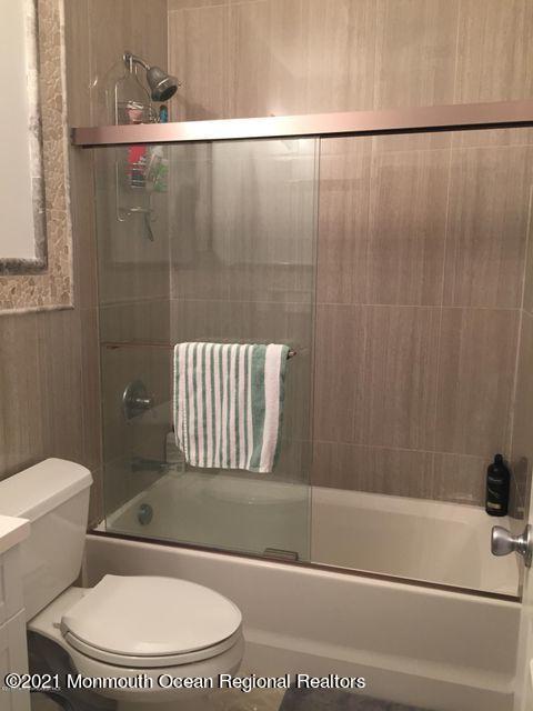 1066 Ocean Avenue, Unit 3 Sea Bright, NJ 07760 - Photo 10 of 12 a bathroom with a toilet and a shower