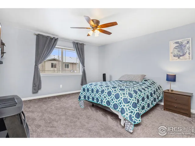 a bathroom with a granite countertop sink toilet and a mirror