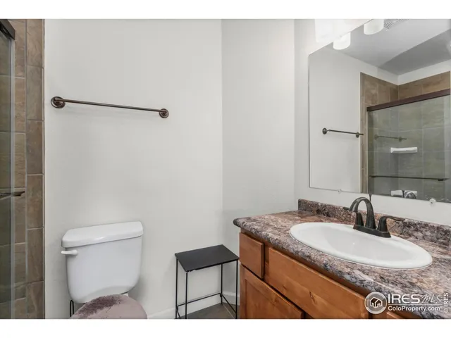 a bedroom with a bed and a cabinets