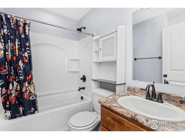 a view of a patio with couple of chairs