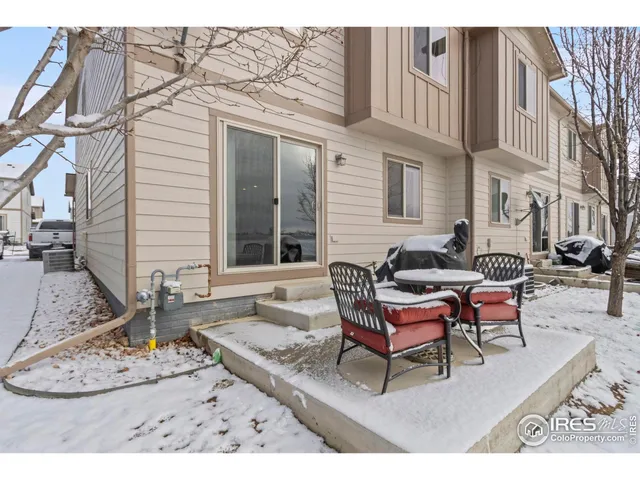a view of a terrace with chairs and a table