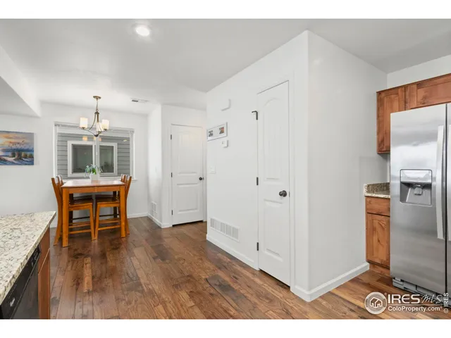 a view of kitchen with furniture and wooden floor
