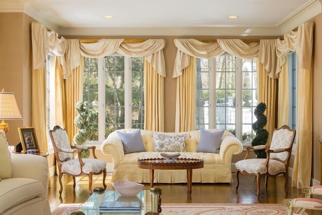 4 Garland Road Lincoln, MA 01773 - Photo 11 of 31 a living room with furniture and a large window