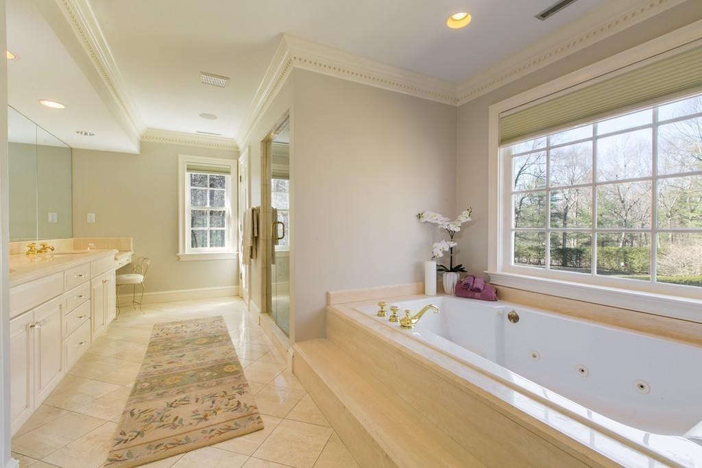 4 Garland Road Lincoln, MA 01773 - Photo 16 of 31 a spacious bathroom with a tub sink and mirror