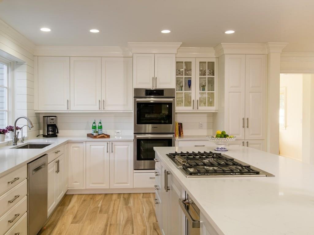 4 Garland Road Lincoln, MA 01773 - Photo 2 of 31 a kitchen with a sink a stove and cabinets