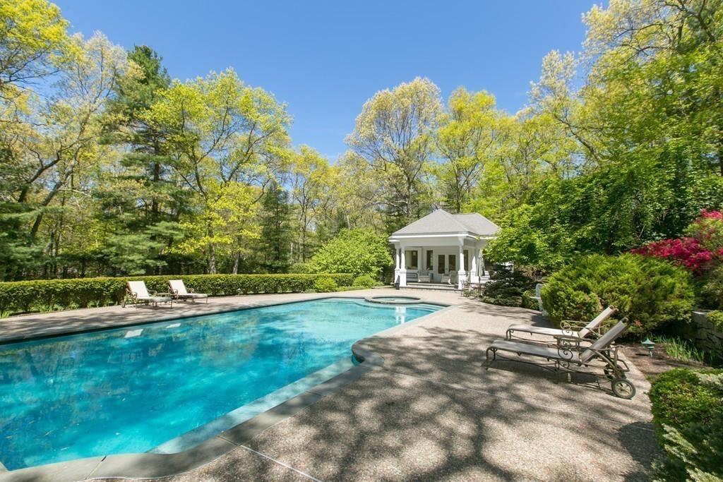 4 Garland Road Lincoln, MA 01773 - Photo 25 of 31 a view of a house with a yard and sitting area