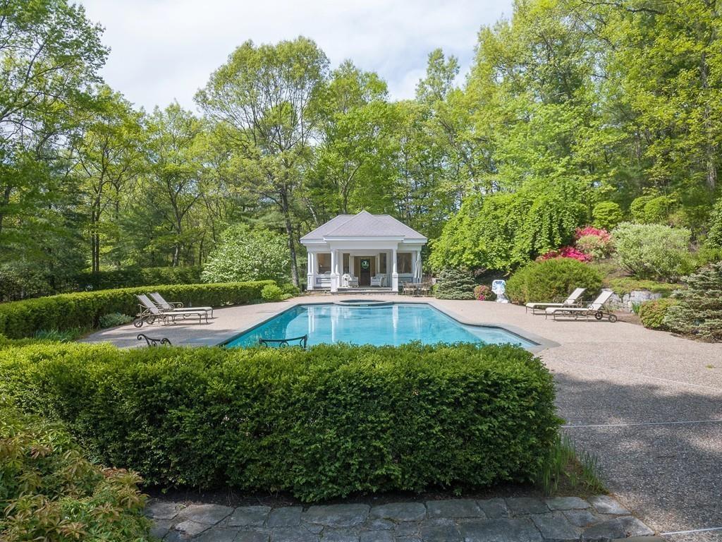 4 Garland Road Lincoln, MA 01773 - Photo 26 of 31 a front view of a house with a yard