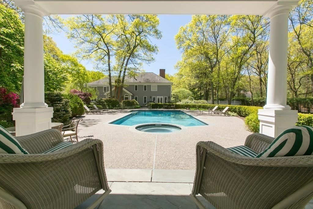 4 Garland Road Lincoln, MA 01773 - Photo 27 of 31 a view of a patio with couches table and chairs and potted plants
