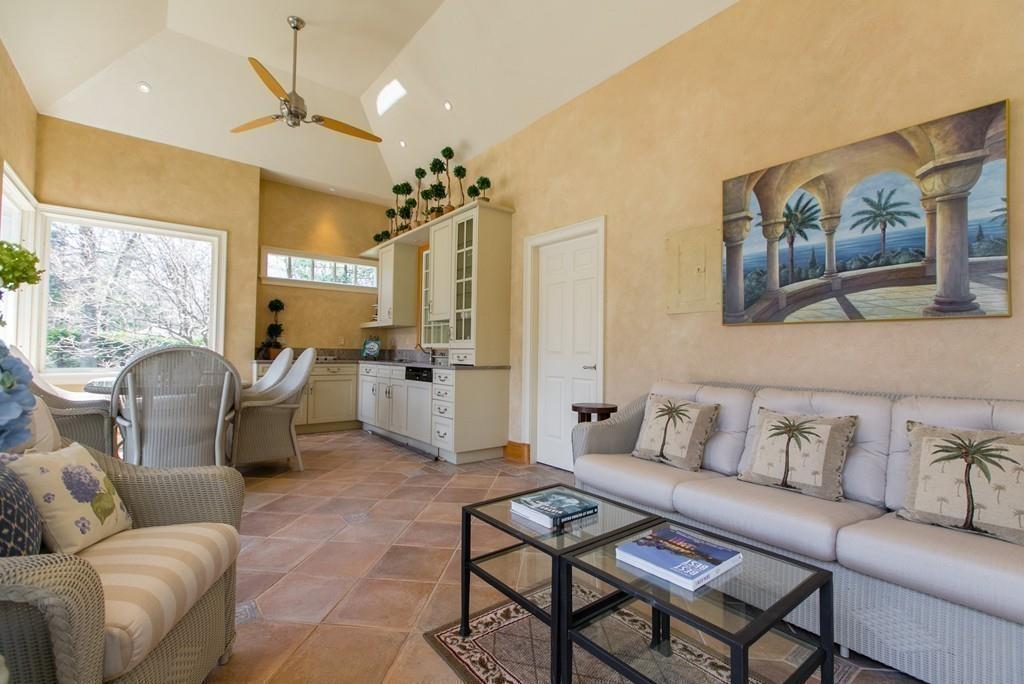 4 Garland Road Lincoln, MA 01773 - Photo 29 of 31 a living room with furniture kitchen view and a chandelier