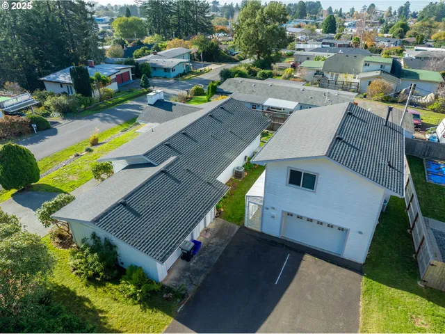 an aerial view of a house with a swimming pool