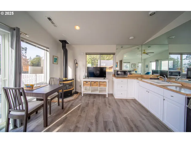 a open kitchen with cabinets a sink and dishwasher