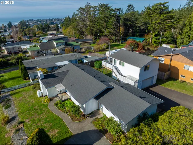 an aerial view of a house with a garden