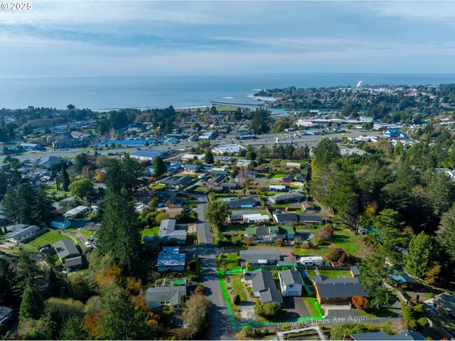 an aerial view of a house with yard swimming pool and outdoor seating