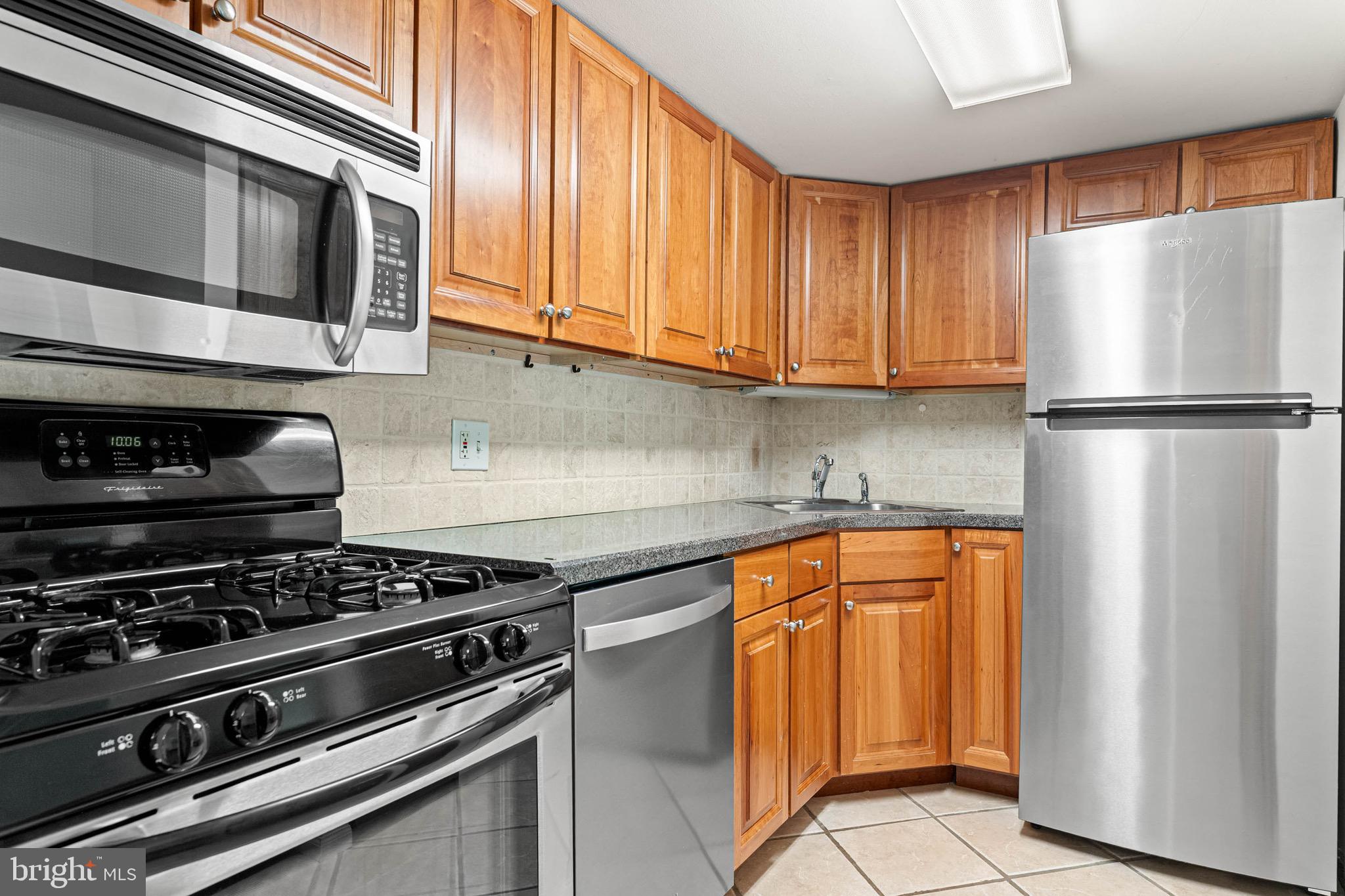 423 Old Forge Crossing, Unit 423 Devon, PA 19333 - Photo 11 of 24 Kitchen w/ ample cabinets and pantry
