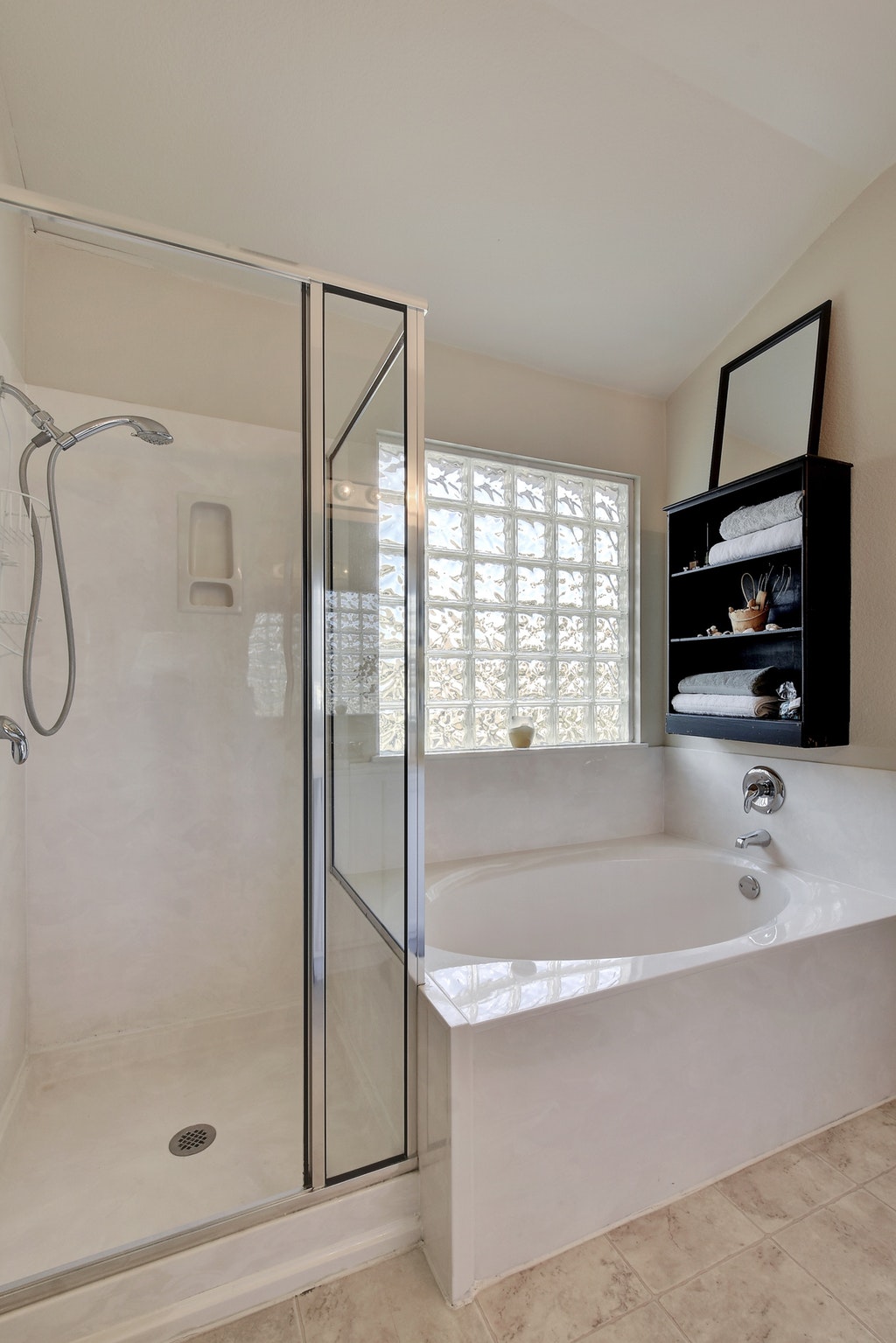 2201 Keepsake Drive Austin, TX 78745 - Photo 15 of 25 a bathroom with a tub a sink and a shower