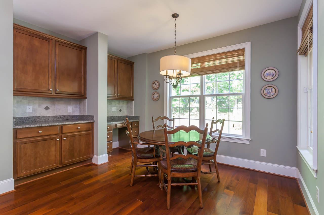 8000 Jessamine Way Raleigh, NC 27612 - Photo 9 of 25 The breakfast room enjoys both a built-in buffet cabinet with storage and a built-in desk. You will never complain about not having enough storage in this house! Breakfast Room